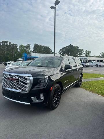 2022 GMC Yukon XL Denali in Onyx Black — front three-quarter view