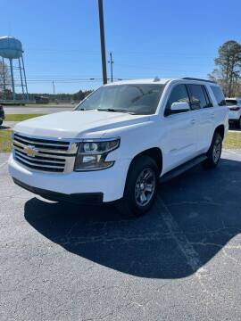 2018 Chevrolet Tahoe LS in Summit White — front three-quarter view