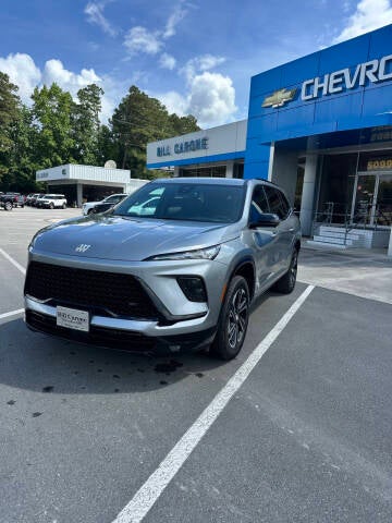 2025 Buick Enclave Sport Touring in Moonstone Gray Metallic — front three-quarter view